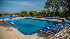 Seasonal outdoor pool, pool loungers