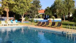 Seasonal outdoor pool, pool loungers