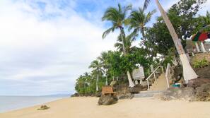 On the beach, sun loungers, beach umbrellas, beach towels