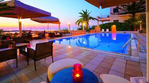 Seasonal outdoor pool, pool umbrellas, pool loungers