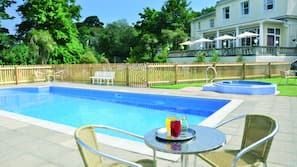 Indoor pool, seasonal outdoor pool, pool umbrellas, pool loungers