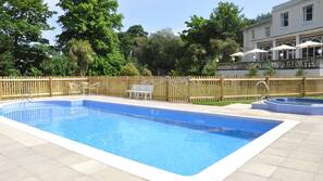 Indoor pool, seasonal outdoor pool, pool umbrellas, pool loungers