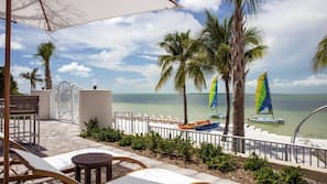 On the beach, sun loungers, beach umbrellas, beach towels