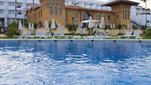 Outdoor pool, pool umbrellas, pool loungers