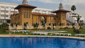 Outdoor pool, pool umbrellas, pool loungers
