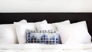 Premium bedding, desk, laptop workspace, blackout drapes
