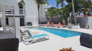 Outdoor pool, pool umbrellas, sun loungers
