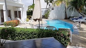 Outdoor pool, pool umbrellas, sun loungers