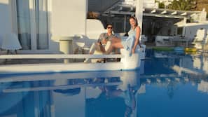 Seasonal outdoor pool, open 9:00 AM to 7:00 PM, sun loungers