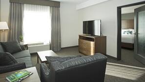 55-inch LCD TV with cable channels, iPod dock