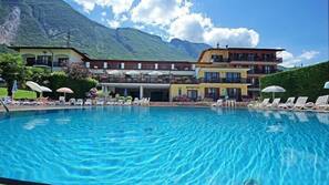 Seasonal outdoor pool, pool umbrellas, pool loungers