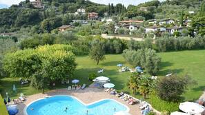 Seasonal outdoor pool, pool umbrellas, pool loungers
