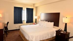 Premium bedding, desk, laptop workspace, iron/ironing board
