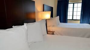 Premium bedding, desk, laptop workspace, iron/ironing board