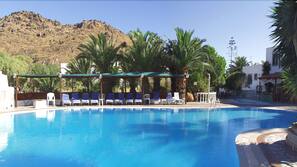 Seasonal outdoor pool, pool umbrellas, pool loungers