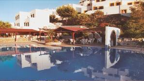 Seasonal outdoor pool, pool umbrellas, pool loungers