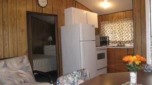 Full-size fridge, microwave, stovetop, coffee/tea maker