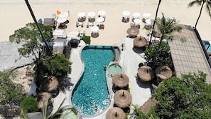 On the beach, sun-loungers, beach umbrellas, beach towels