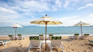 On the beach, sun-loungers, beach umbrellas, beach towels