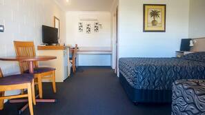 Minibar, desk, laptop workspace, iron/ironing board