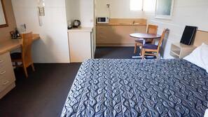 Minibar, desk, laptop workspace, iron/ironing board