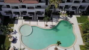 Outdoor pool, pool umbrellas, sun loungers