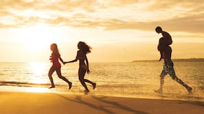 On the beach, sun loungers, beach umbrellas, beach towels