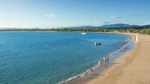On the beach, sun loungers, beach umbrellas, beach towels