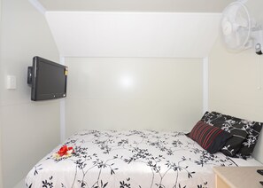 Compact Single Van Room with Shared Amenities | Desk