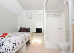 Compact Single Van Room with Shared Amenities | Desk
