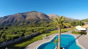 Seasonal outdoor pool, pool umbrellas, pool loungers