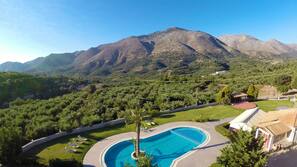 Seasonal outdoor pool, pool umbrellas, pool loungers
