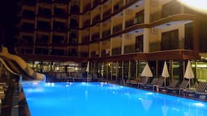 Indoor pool, outdoor pool, pool umbrellas, pool loungers