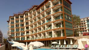 Indoor pool, outdoor pool, pool umbrellas, pool loungers