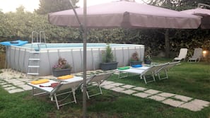 Seasonal outdoor pool, pool umbrellas, pool loungers