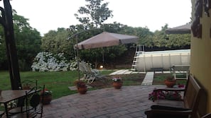 Seasonal outdoor pool, pool umbrellas, pool loungers