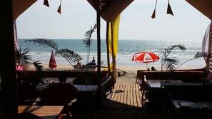 On the beach, white sand, sun-loungers, beach umbrellas