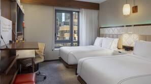 Premium bedding, pillow top beds, desk, laptop workspace
