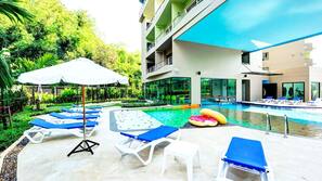 Indoor pool, outdoor pool, pool umbrellas, pool loungers