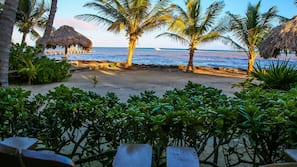 Private beach, white sand, sun loungers, beach umbrellas