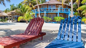 Private beach, white sand, sun loungers, beach umbrellas