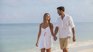 Private beach, sun loungers, beach towels, beach massages