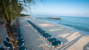 Private beach, sun loungers, beach towels, beach massages