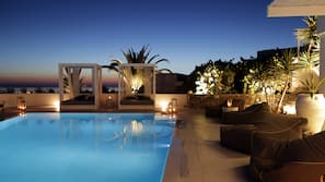 Seasonal outdoor pool, open 11:00 AM to 8:00 PM, free cabanas