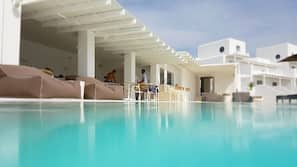 Seasonal outdoor pool, open 11:00 AM to 8:00 PM, free cabanas