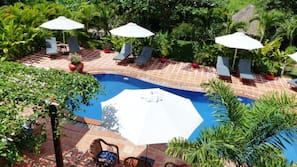 Outdoor pool, pool umbrellas, sun loungers