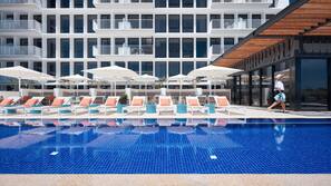 Outdoor pool, pool umbrellas, pool loungers