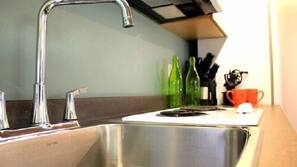 Full-size fridge, microwave, stovetop, coffee/tea maker