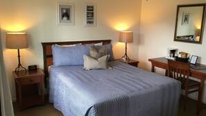 Premium bedding, desk, laptop workspace, blackout drapes