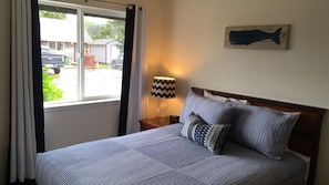 Premium bedding, desk, laptop workspace, blackout drapes